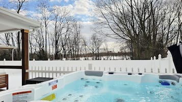 Relax in a hot tub surrounded by serene views of the surrounding landscape.