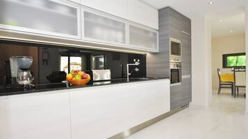 Villa | Private kitchen | Fridge, microwave