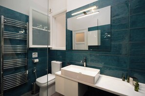 Shower, hair dryer, soap, shampoo