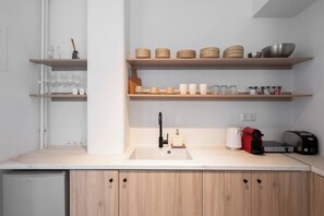 Fridge, coffee/tea maker, electric kettle, cookware/dishes/utensils