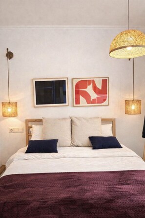 1 habitación y tabla de planchar con plancha 