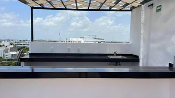 Departamento Confort, vista al mar | Área de sala de estar