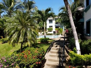 Exterior - Minimalist Condo with a Beautiful New Design, Enclosed Patio, and Shared Community Pool (Las Palmas, Coco)