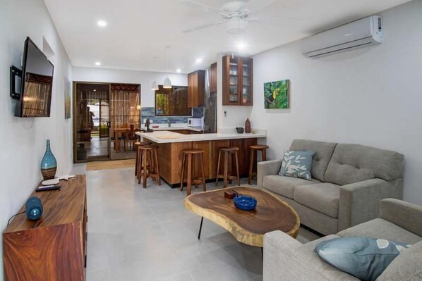 TV, offices - Minimalist Condo with a Beautiful New Design, Enclosed Patio, and Shared Community Pool (Las Palmas, Coco)