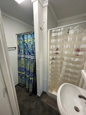 Shower, towels, soap, toilet paper