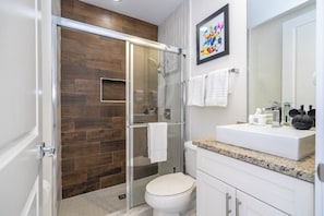 Shower, eco-friendly toiletries, hair dryer, towels