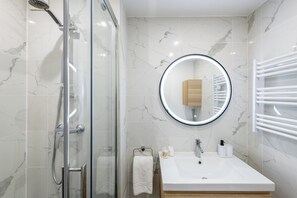 Shower, hair dryer, towels, soap