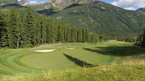 A golf course with a clear view of mountains in the background. - Spacious Toby Creek loft with river and mountain views (Panorama)