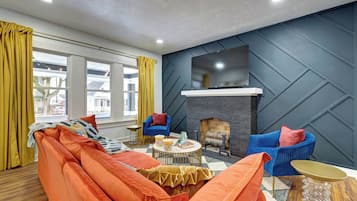 Smart TV, fireplace, foosball, books