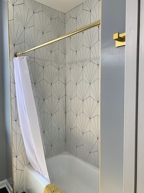 Shower, hair dryer, towels, toilet paper