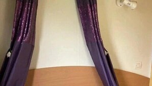 A bed with a canopy, two pillows, and a headboard.