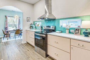 Enjoy cooking in this well-equipped kitchen with an oven, range hood, and large island.