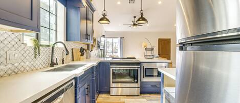 Fridge, stovetop, dishwasher, coffee/tea maker