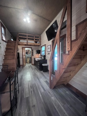 Family Loft, Patio, Resort View | Living area | 42-inch Smart TV with digital channels - Tiny Home Resorts (Denison)