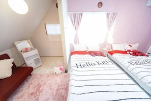 A bedroom with two beds, a desk, a chair, a small table, and a window with curtains. - Higashiomi Large House (Higashiomi)