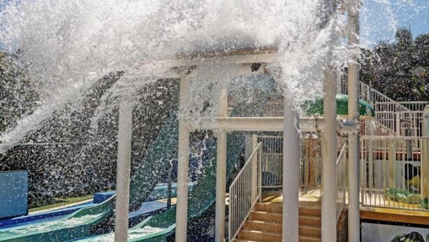 A water play area with a slide and stairs. - Turtle Beach Resort (Mermaid Beach)
