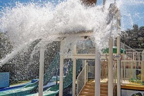 A water play area with a slide and stairs. - Turtle Beach Resort (Mermaid Beach)