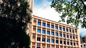 A multi-story building with a symmetrical facade, large windows, and a flat roof. - Agrabad Hotel (Chittagong)