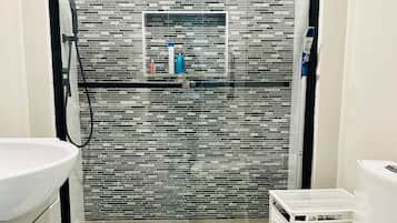 Shower, hair dryer, towels, soap