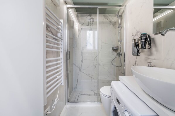 Hair dryer, towels, soap, toilet paper
