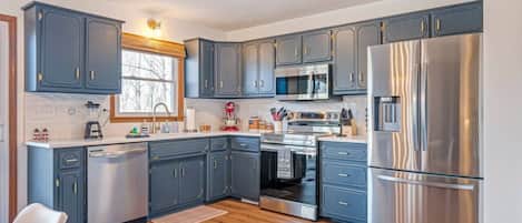 Fridge, microwave, stovetop, coffee/tea maker