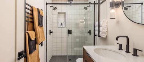 Shower, hair dryer, towels, shampoo