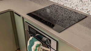 A kitchen with a built-in stovetop and dishwasher. - Slopeside Suite at Alyeska - Ski In Ski Out (Girdwood)