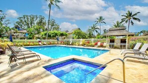 A swimming pool with lounge chairs and a small gazebo. - Chic Aloha Studio in Superb Princeville, w/AC & WiFi 
Explore Beautiful Napali! (Princeville)