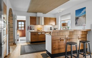 Fridge, stovetop, dishwasher, coffee/tea maker