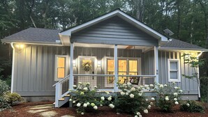 A two-story house with a porch, a covered entryway, and a number '80' on the side. - Cozy Mountain Hideaway, Next to Hiking Trails & Waterfalls! (Highlands)