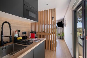 Fridge, microwave, stovetop, coffee/tea maker