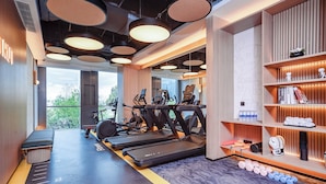 A modern gym with treadmills, ellipticals, and free weights. - EVEN Hotel Shanghai Jinqiao by IHG (Shanghai)