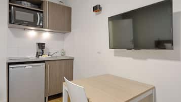 Microwave, stovetop, dining tables