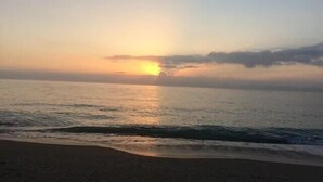 A beach with a sunset over the ocean. - CP 233 Ocean View Condo - Welcome to Paradise (Fort Pierce)