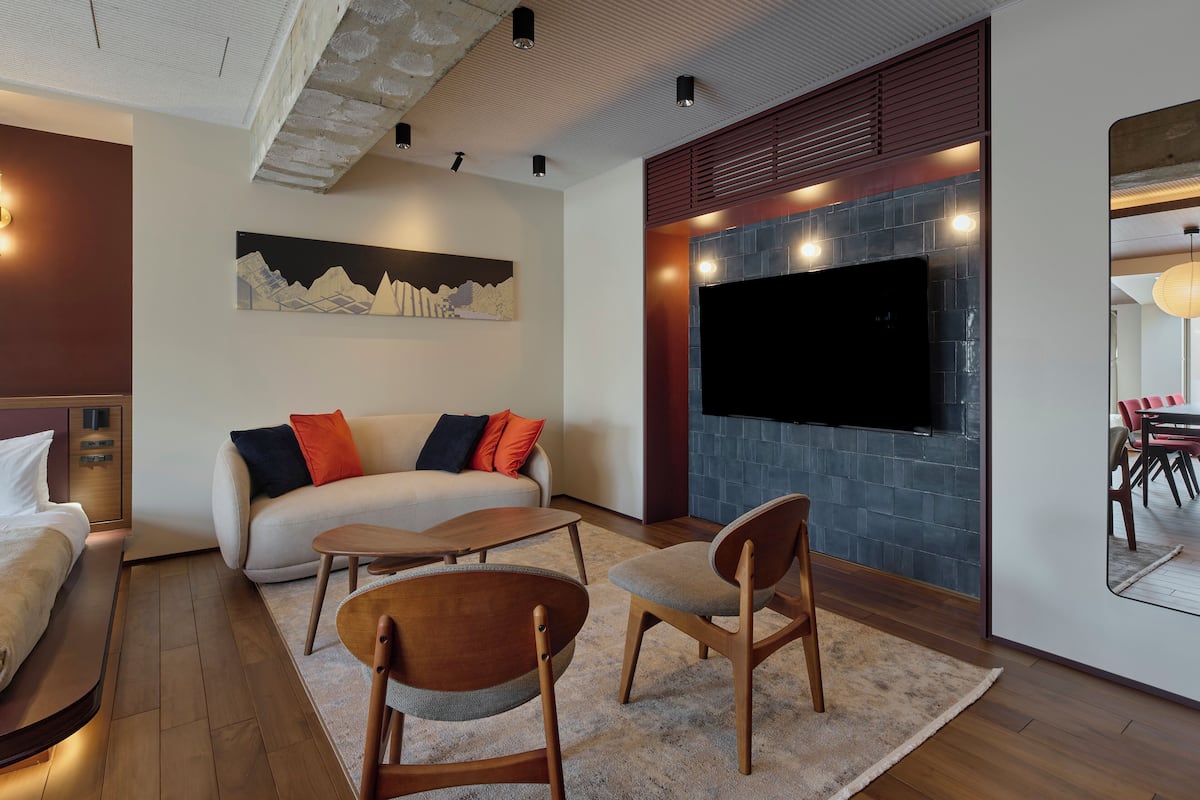 Deluxe Room | Living area | 60-inch Smart TV with digital channels, streaming services