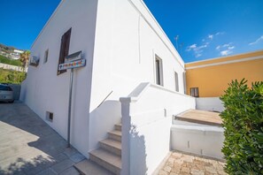 A white building with a sign indicating a convention. - Marisole House With Sea View, Santa Cesarea Terme, Italy (Santa Cesarea Terme)