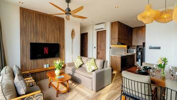 Apartment, 2 Bedrooms | Living area | 32-inch TV with digital channels