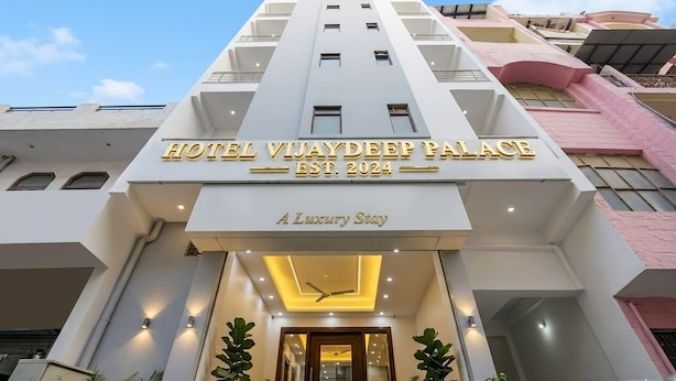 A modern hotel entrance with a sign reading 'HOTEL VIAYDEEP PALACE EST. 2024' and 'A Luxury Stay'. - Hotel Vijaydeep Place Near Delhi Airport (New Delhi)