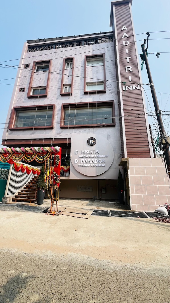 A building with a sign for 'D' KRISTA THE FINE DINE & BANQUET' and 'D' PARADOX THE ROOF TOP BISTRO'. - Aaditri Inn (Gorakhpur)