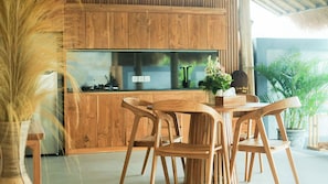 Full-sized fridge, cookware/dishes/utensils, dining tables