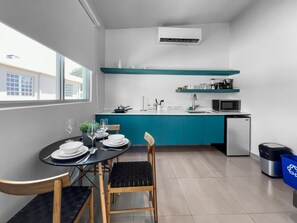 Microwave, stovetop, coffee/tea maker, cookware/dishes/utensils