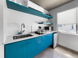 Microwave, stovetop, coffee/tea maker, cookware/dishes/utensils