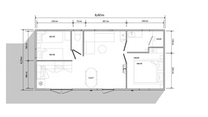 Een plattegrond van een hotelkamer, 8,60 meter bij 4,20 meter, met een badkamer, kitchenette en zithoek.