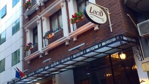A hotel facade with a sign reading "Lucid." - Lucid Otel (Izmir)