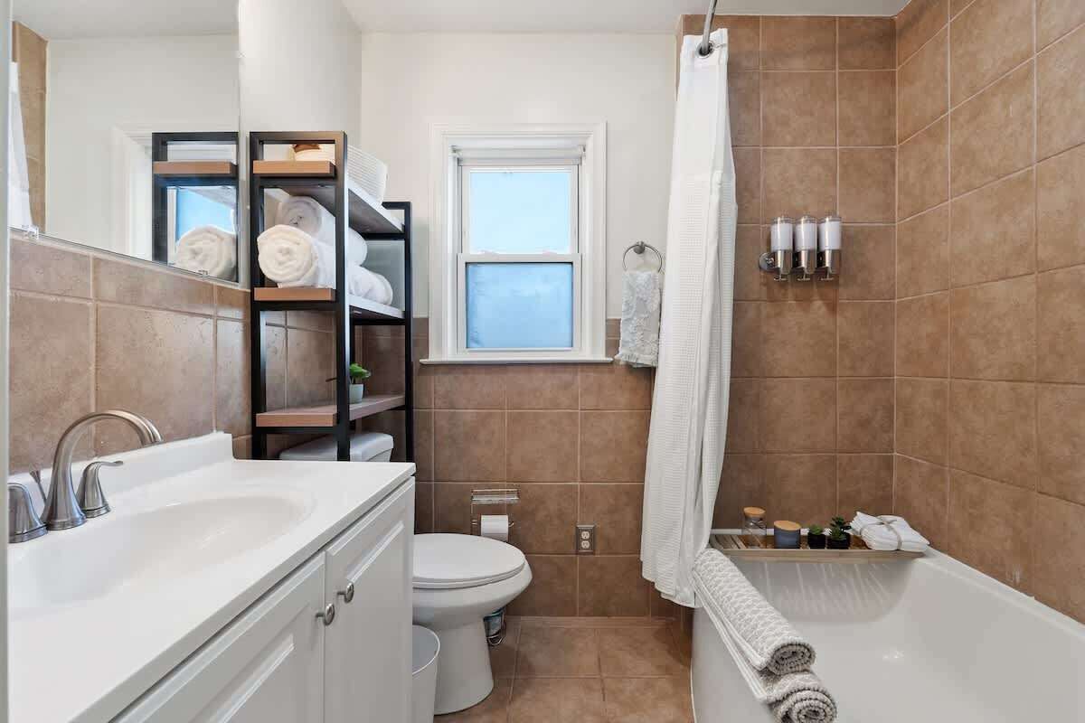 Shower, hair dryer, towels, shampoo