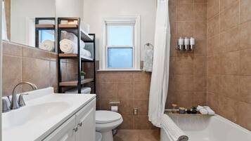 Shower, hair dryer, towels, shampoo