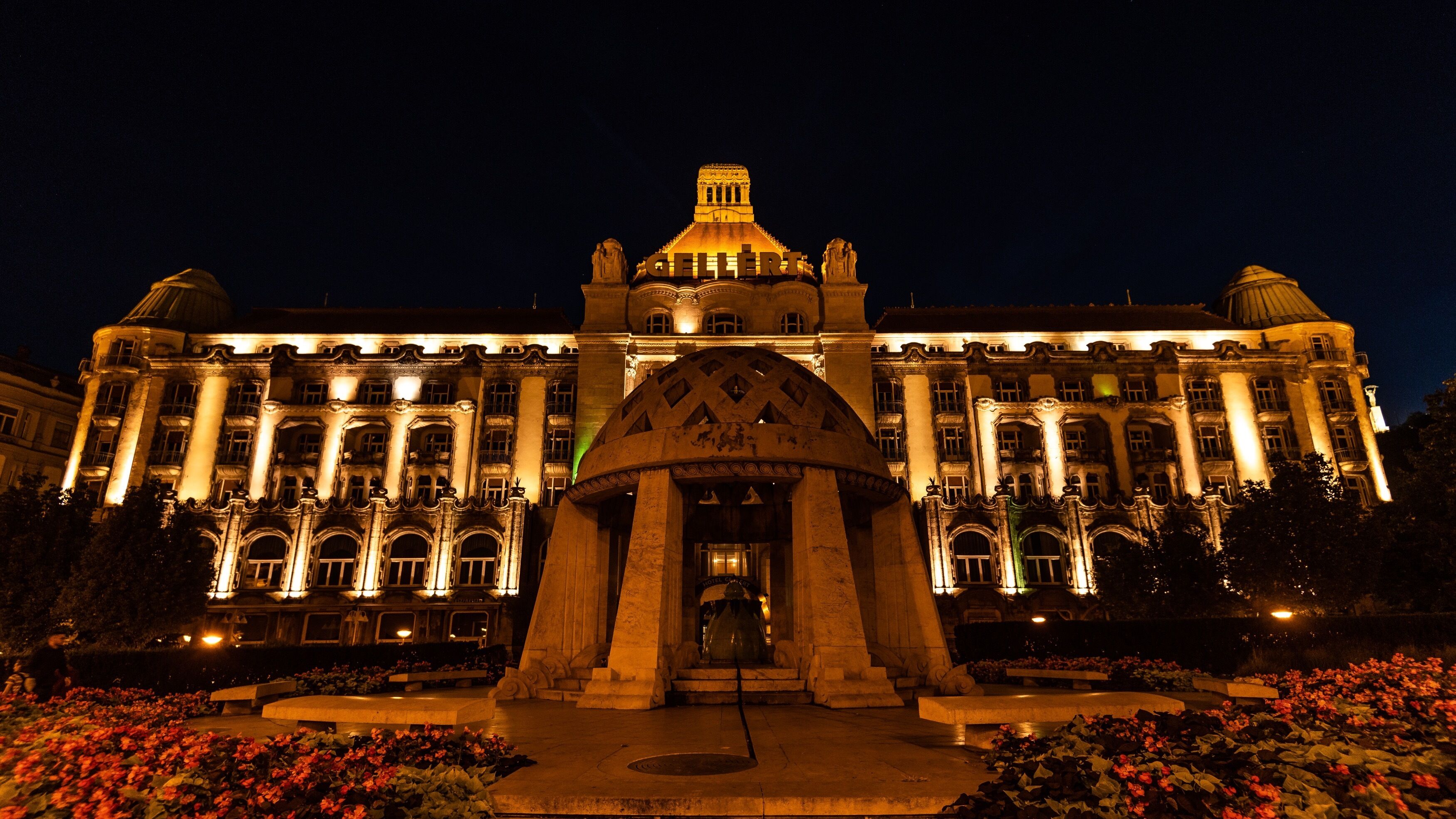 A grand building with a prominent entrance, large columns, and a dome.