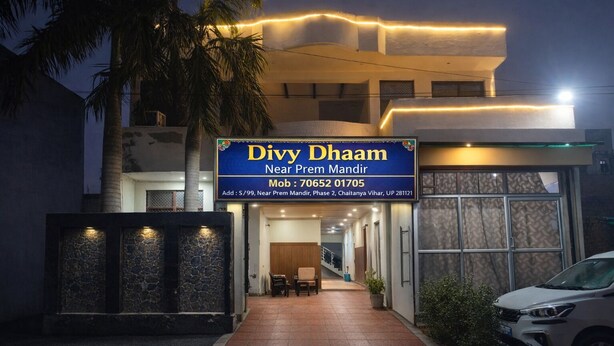 A hotel named Divy Dhaam with a signboard, entrance, and a car parked in front. - Divy Dhaam Near Prem Mandir (Vrindavan)