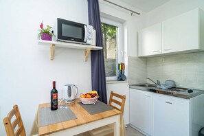 Apartment | Private kitchen | Fridge, microwave, stovetop, electric kettle
