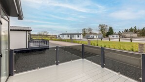 A modern building with a flat roof and a balcony.